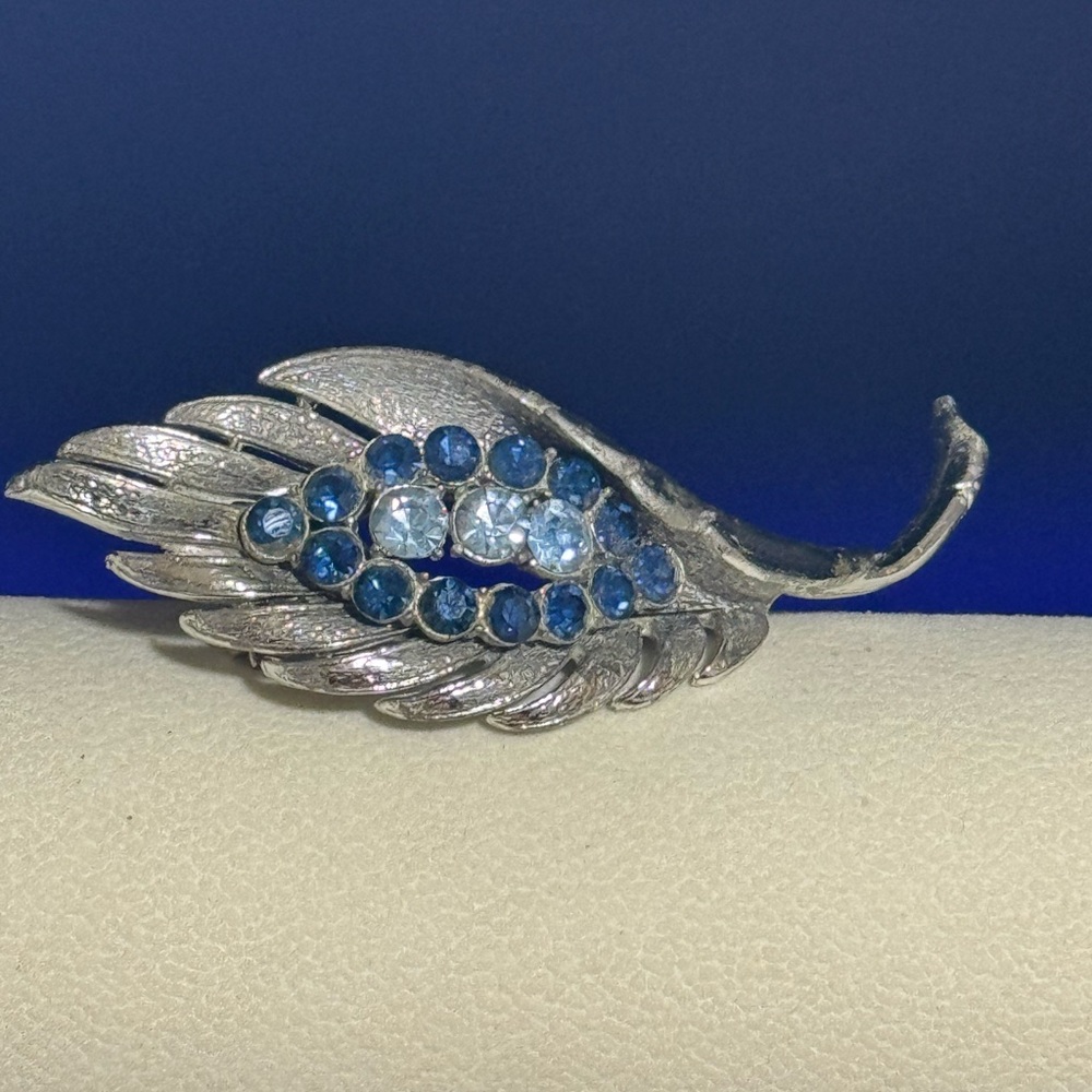 Vintage Coro Pegasus Leaf Brooch in silver tone with blue rhinestones.  Signed